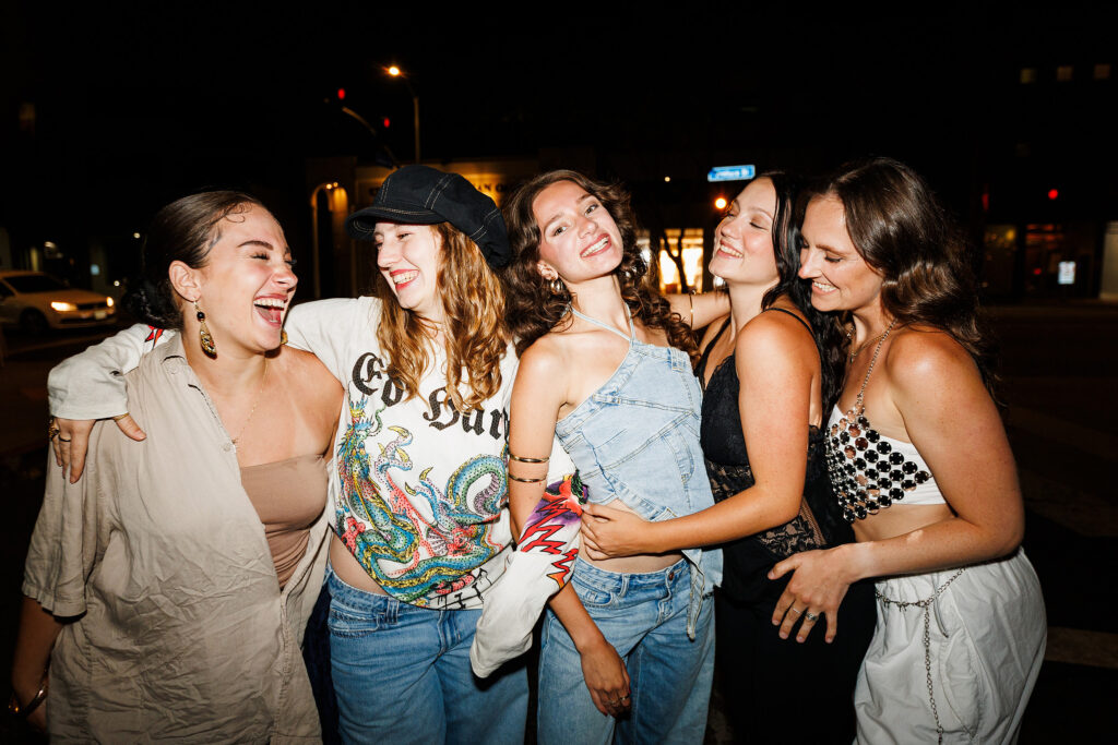 Group of dancers laughing together on an L.A. street at night, from the Dance in L.A. programs